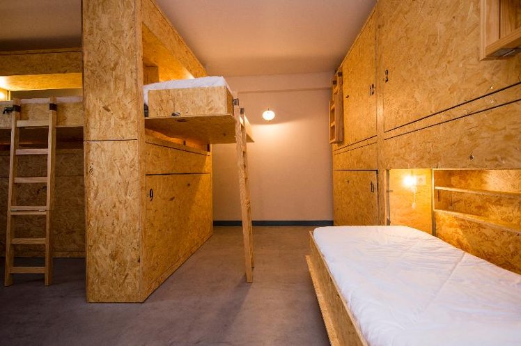 Bed in dormitory TWELVE BEDROOMS Room
